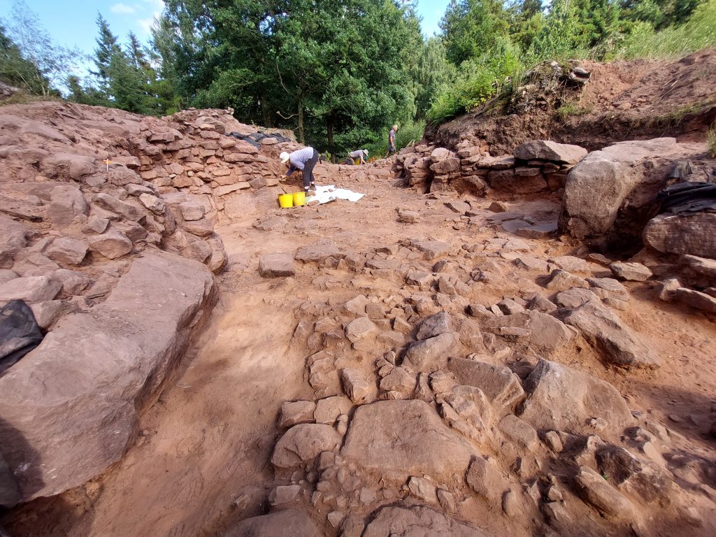 Members of the tea at work at the entrance of the hillfort.